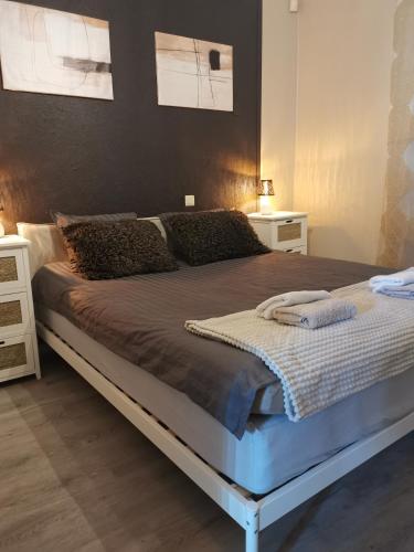 a bedroom with a large bed in a room at Guest House ALEJA in Myza Bene