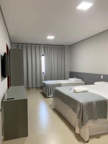 Ένα ή περισσότερα κρεβάτια σε δωμάτιο στο Oceane Norte Hotel