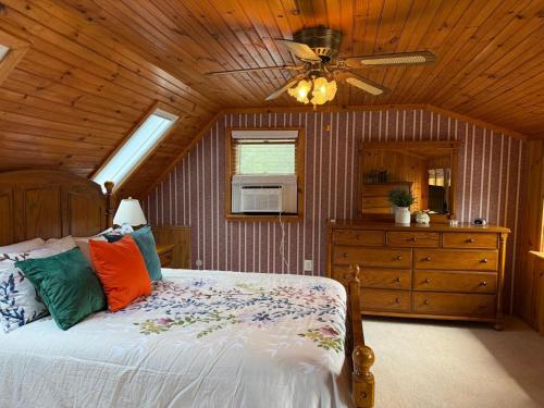 a bedroom with a bed and a ceiling fan at Susquehanna Waterfall Haven in Susquehanna