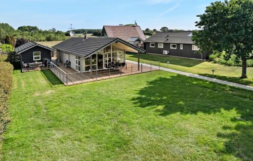 an aerial view of a house with a yard at Holiday Home Hejsager Strandby I in Kelstrup Strand