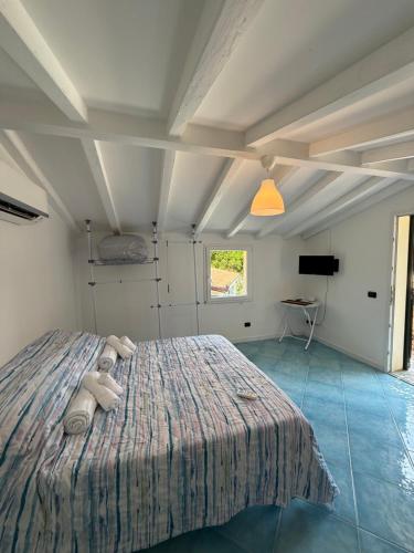 a bedroom with a bed with a teddy bear on it at Innovation House in La Spezia