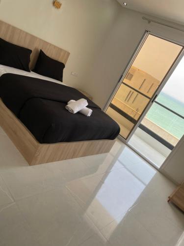 Una cama o camas en una habitación de Inyan Dakhla Hotel