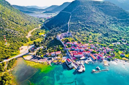 an aerial view of a small village on a lake at Apartment Luna Pelješac in Dubrava