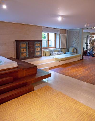 a large living room with a bed and a couch at Stately Home in Magdalenka Warsaw in Magdalenka