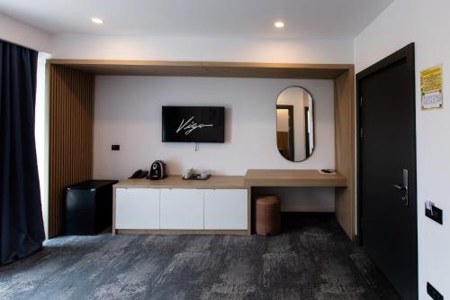 TV a/nebo společenská místnost v ubytování Hotel Vigo