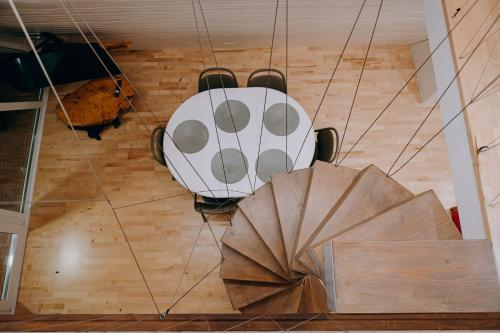 an overhead view of a car hanging from a ceiling at La Căsuțe Luxury in Piatra Neamţ