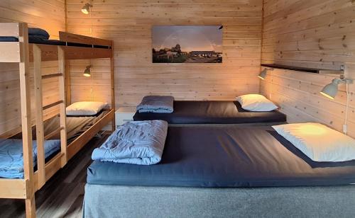 Postel nebo postele na pokoji v ubytování Piilijärvi Camping