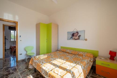 Ένα ή περισσότερα κρεβάτια σε δωμάτιο στο Casa Libeccio