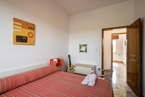 Ένα ή περισσότερα κρεβάτια σε δωμάτιο στο Casa Libeccio