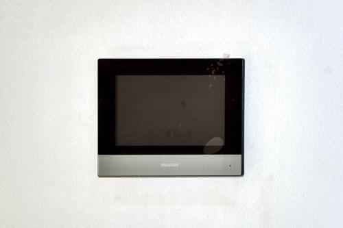 a small television sitting on a white wall at La Villa Del Mar in Agadir