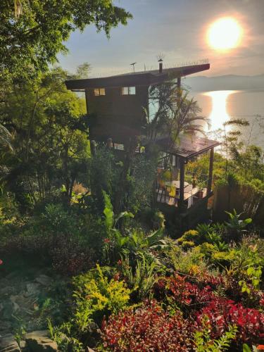 a house on the hill with a garden at Luxury Casa Árbol Amazing View in Jaibalito