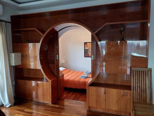 a room with an archway with a bed in it at Amfissa Luxury Apartment in Ámfissa