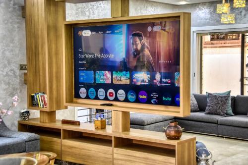 a large flat screen tv in a living room at La Villa Del Mar in Agadir