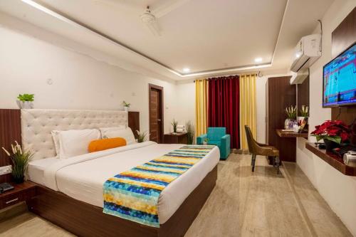 Postel nebo postele na pokoji v ubytování Hotel ORIGIN Hyderabad Airport