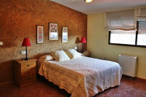 a bedroom with a bed and a window at Casalvito in Rial