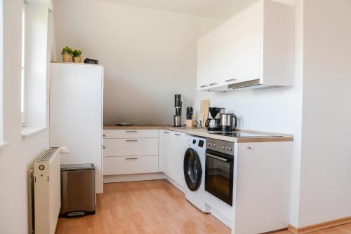 Dapur atau dapur kecil di Ferienwohnung Rhader Wiesen