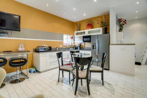 a kitchen with a table and chairs and a refrigerator at 11 Mi to Bear World Riverfront Getaway in Rigby in Rigby
