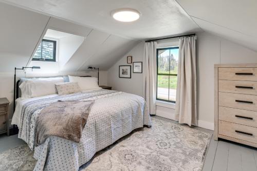 a bedroom with a bed and a dresser and a window at Pond Views Spacious Family Home in Presque Isle! in Presque Isle