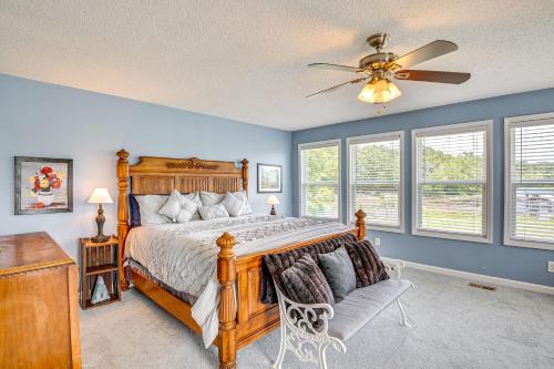 a bedroom with a bed and a ceiling fan at Fire Pit and BBQ Lake Guntersville Family Home in Hollywood