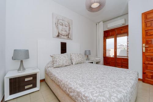 Katil atau katil-katil dalam bilik di Apartamento con la playa a 200 metros