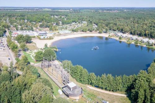 an aerial view of a lake with a amusement park at Ons Schatje op 5-sterren vakantiepark De Schatberg in Sevenum
