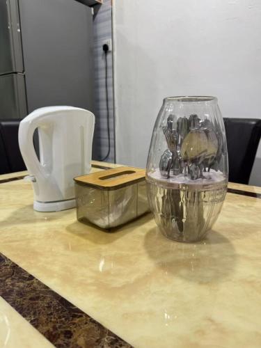 a glass bowl sitting on top of a counter at Best Day Homestay ! in Kangar