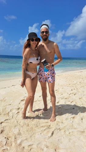 a man and a woman standing on a beach at Rooms on San Blas Islands Icodub in Panama City