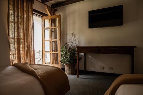 Postel nebo postele na pokoji v ubytování QASA Valle Sagrado by Nomad