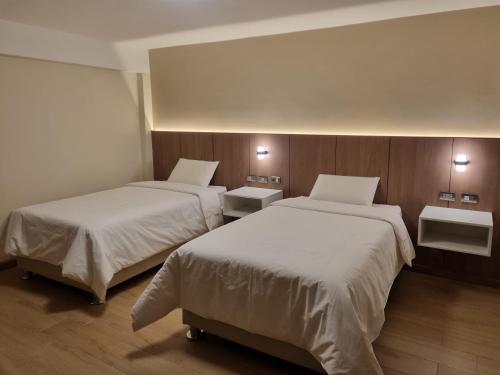 Katil atau katil-katil dalam bilik di Hotel Rey
