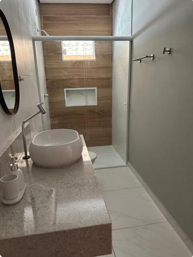 a bathroom with a shower and a sink and a toilet at Lençóis Maranhenses - Casa Armonia in Santo Amaro