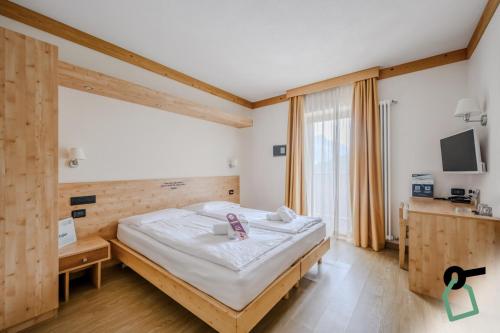 Postel nebo postele na pokoji v ubytování Hotiday Bormio Valdidentro