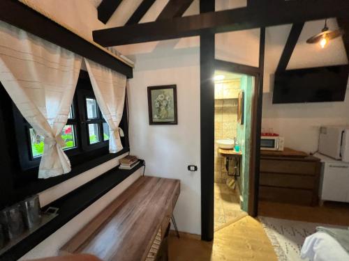 a room with a wooden bench in a room at Blaje in Breaza de Jos