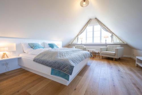 Ένα ή περισσότερα κρεβάτια σε δωμάτιο στο Nordseehaus Föhr Hausteil 2