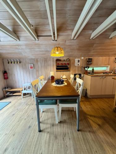 a dining room with a table and chairs at Bard Cottage in Akranes