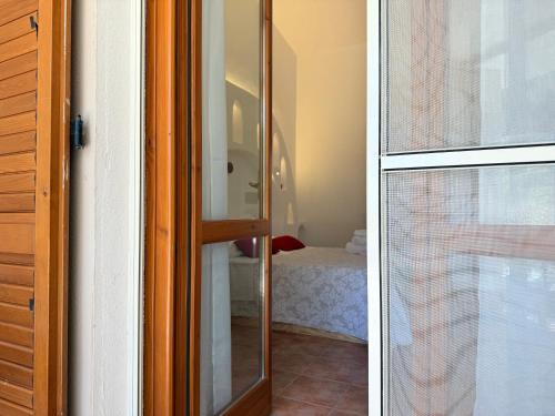 Postel nebo postele na pokoji v ubytování Green Hotel "I Mandorli di Dommos"