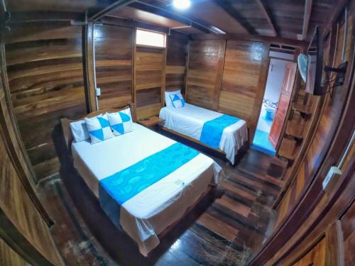 Postel nebo postele na pokoji v ubytování Hotel Delfín Real