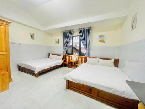 Кровать или кровати в номере De Luna House Dalat - Homestay giá rẻ