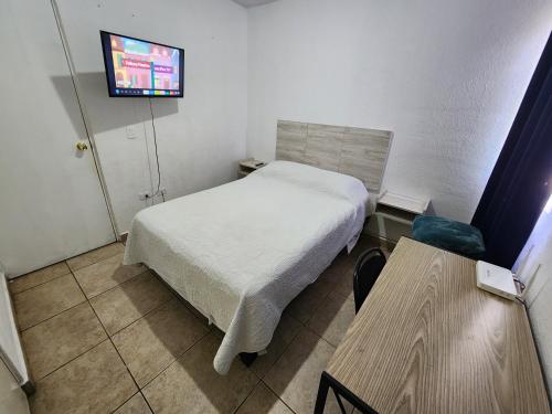 Televiisor ja/või meelelahutuskeskus majutusasutuses Casa céntrica, en privada con acceso controlado
