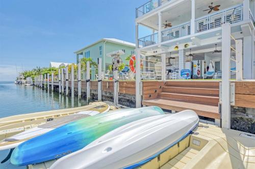 a couple of boats are parked on a dock at Casa Playa- Luxury Pool Home, 36' Dock in Marathon