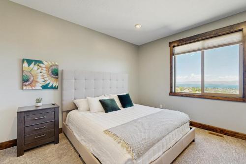 a bedroom with a large bed and a window at The Big Blue in Garden City