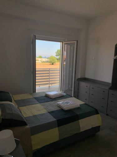 Ένα ή περισσότερα κρεβάτια σε δωμάτιο στο Moonlight Apartments