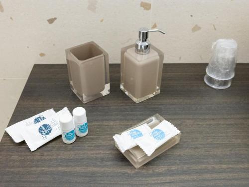 a bathroom with a soap dispenser and toiletries at Domus Eterea in Marsala