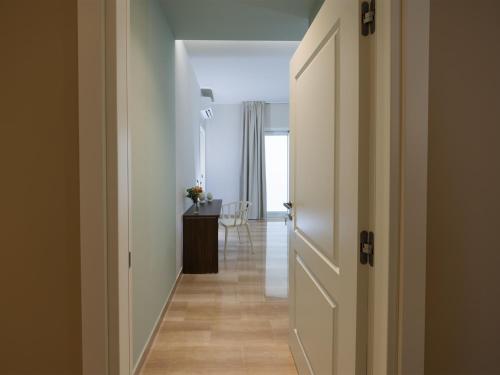 a hallway with a door leading to a room at Domus Eterea in Marsala