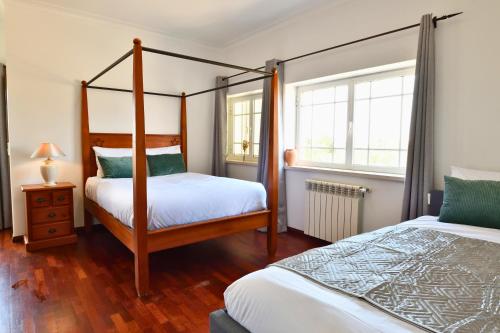 En eller flere senge i et værelse på Casa do Sol Wellness Homestay