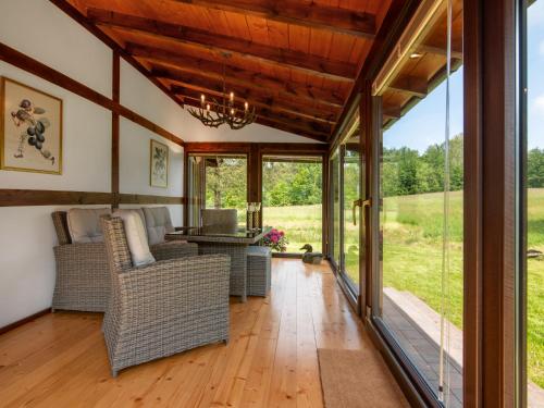 an open living room with sliding glass doors at Holiday Home Sianowska Huta by Interhome in Sianowska Huta