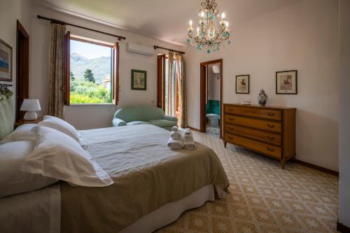 Postel nebo postele na pokoji v ubytování Casa del carrubo
