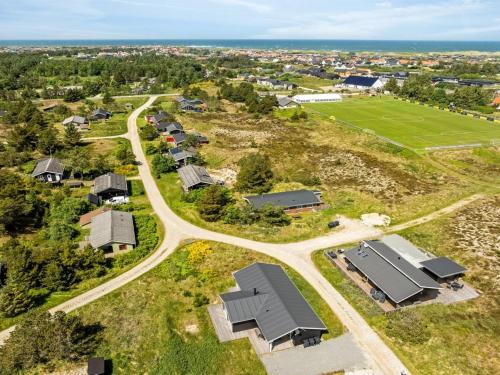 an aerial view of a village with houses and a road at Holiday Home Raakel - 950m from the sea by Interhome in Torsted