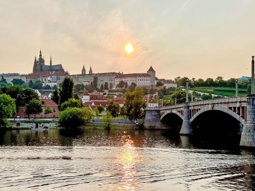 a bridge over a river with a city in the background at Holiday Home Florida by Interhome in Prague