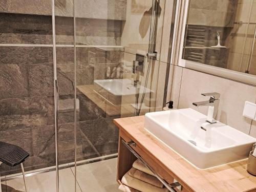 a bathroom with a sink and a shower at Apartment Apartement Haus Dankl by Interhome in Fusch an der Glocknerstraße