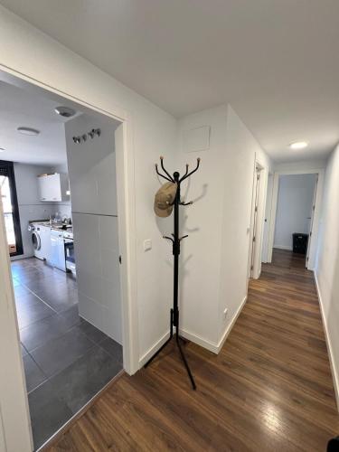 a living room with a white wall and a floor at Apartment in campello Beach in El Campello